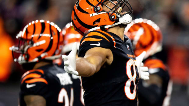 Jan 15, 2022; Cincinnati, OH, USA; Cincinnati Bengals tight end C.J. Uzomah (87) celebrates after the AFC wild card game against the Las Vegas Raiders on Saturday, Jan. 15, 2022, at Paul Brown Stadium in Cincinnati. Mandatory Credit: Albert Cesare-USA TODAY Sports